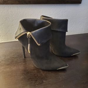 Black booties with gold accents
